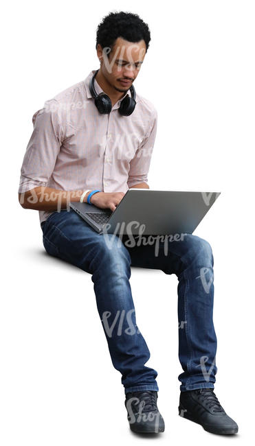 african man sitting and working with a laptop