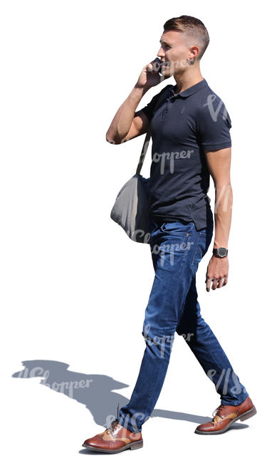 man walking and talking on a phone