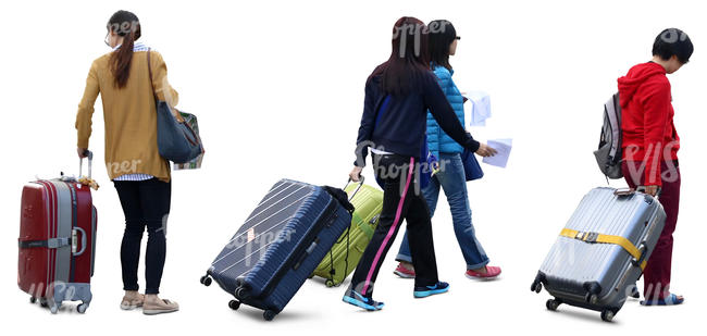 four asian women travelling with big suitcases