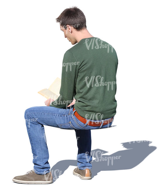 man sitting and reading a book