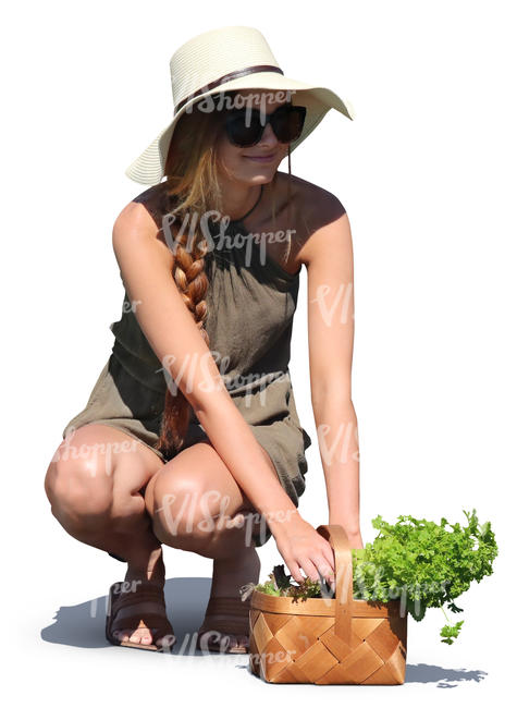 woman with a herbs basket squatting