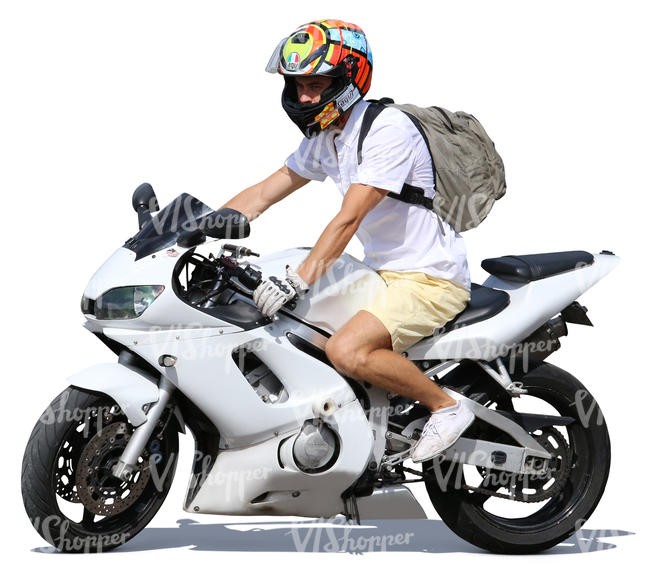 man in shorts riding a motorcycle