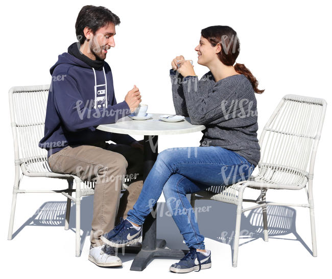 man and woman sitting in a cafe and drinking coffee