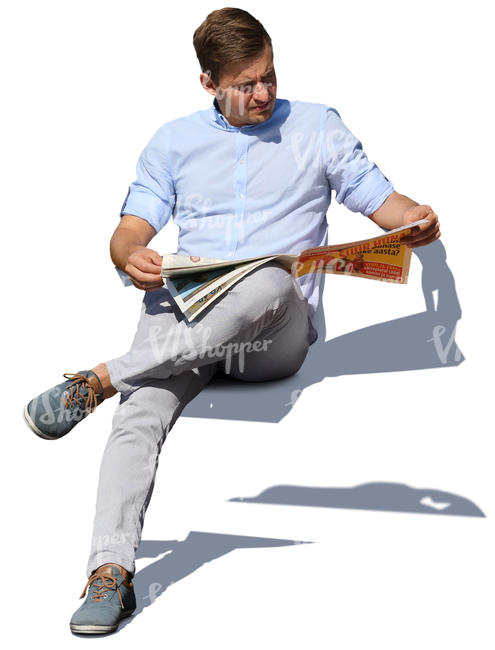 man sitting and reading a newspaper