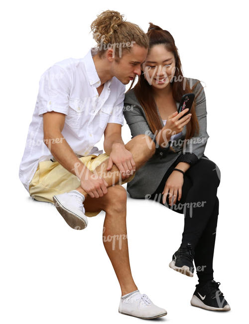 asian woman and a young mand looking smth from her phone