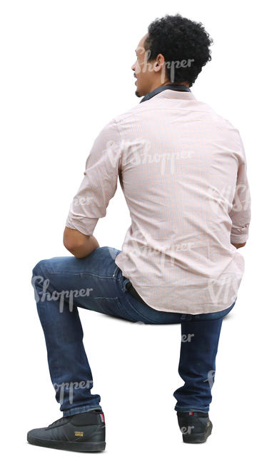 african man sitting in ambient light