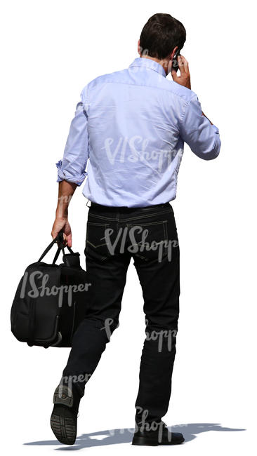 man carrying a bag and talking on a phone
