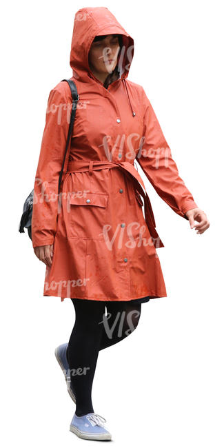 woman in an orange raincoat walking