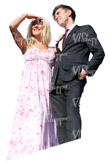 couple in party clothes standing on a balcony