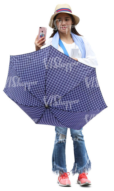 young woman with an umbrella standing and taking picture
