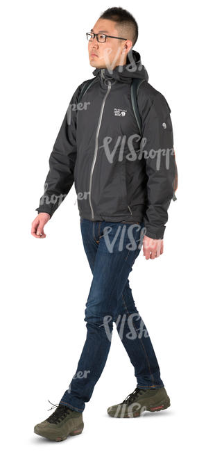 asian man in a hooded sports jacket walking 