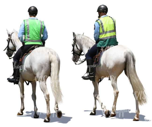 two mounted police officers riding