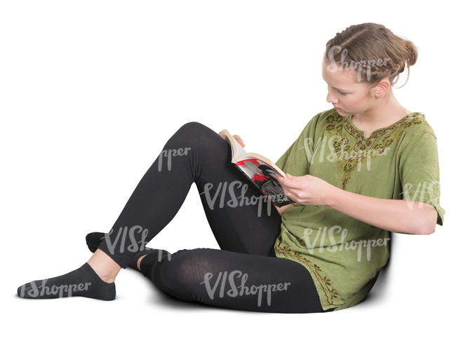 teenage girl sitting on a sofa and reading a book