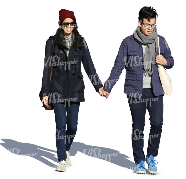 young asian couple walking hand in hand