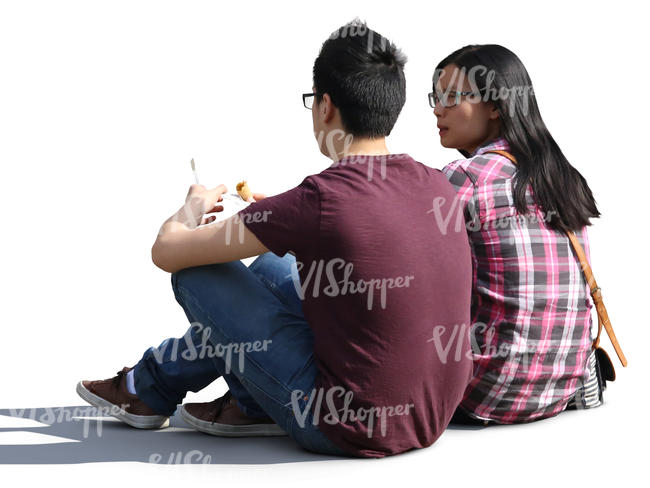 asian couple sitting on the ground