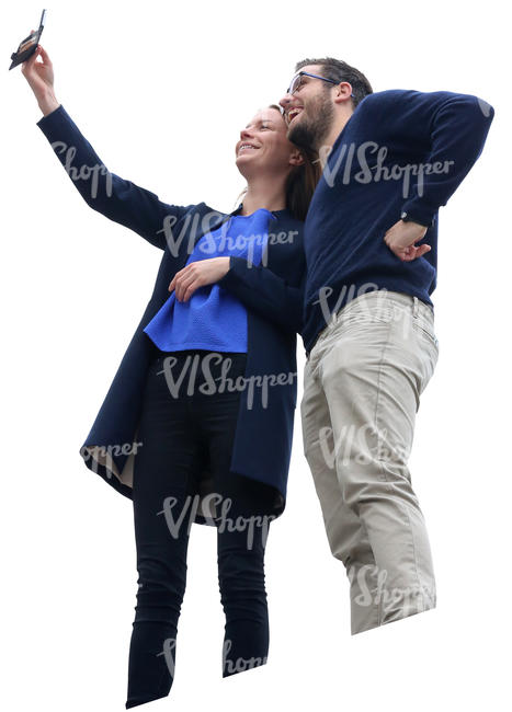 man and woman standing on a balcony and taking a selfie