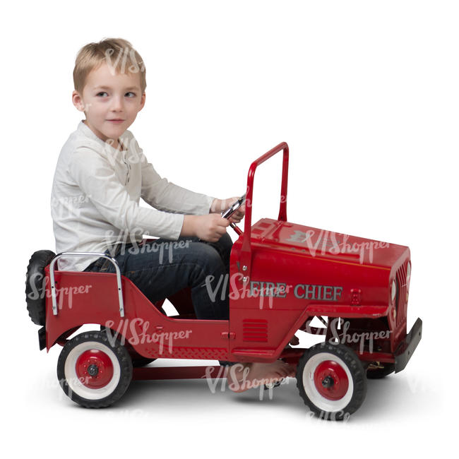 little boy driving a toy car