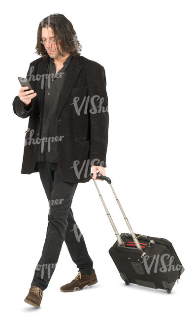 man with a suitcase walking and checking his phone
