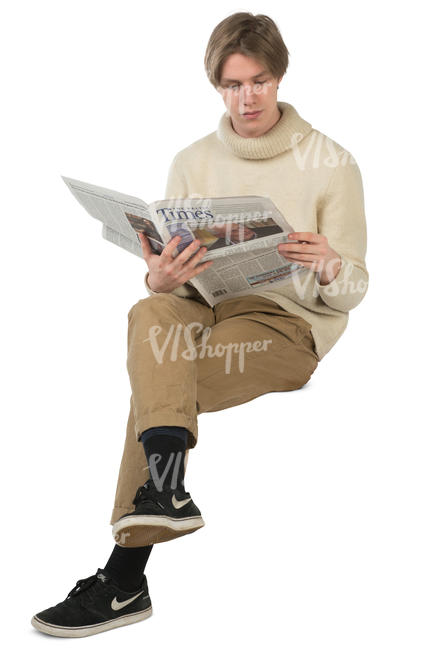 young man sitting and reading a newspaper