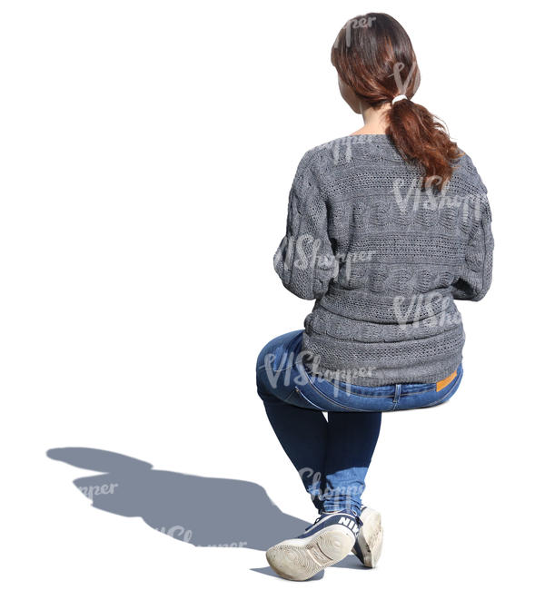 woman in a grey sweater sitting