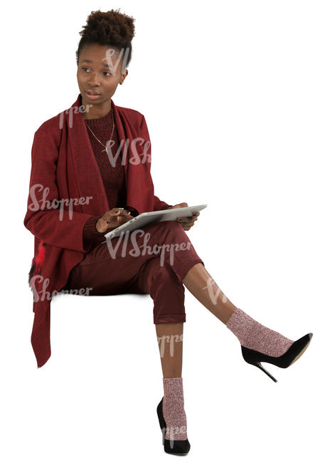 african woman sitting and working with tablet