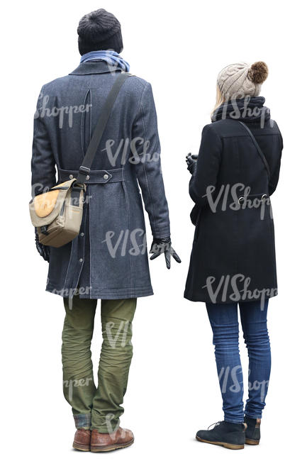 man and woman in autumn coats standing