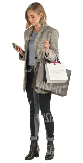 woman with shopping bags standing and texting