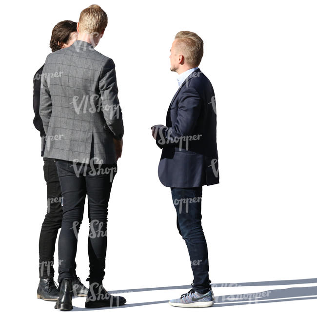 group of three young men standing and talking