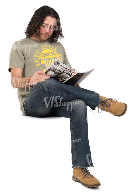 man sitting and reading a magazine