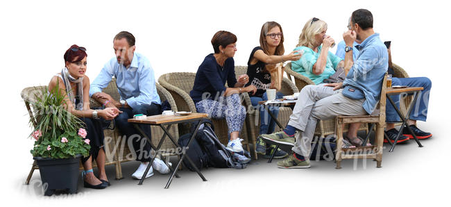 group of people sitting in a street cafe