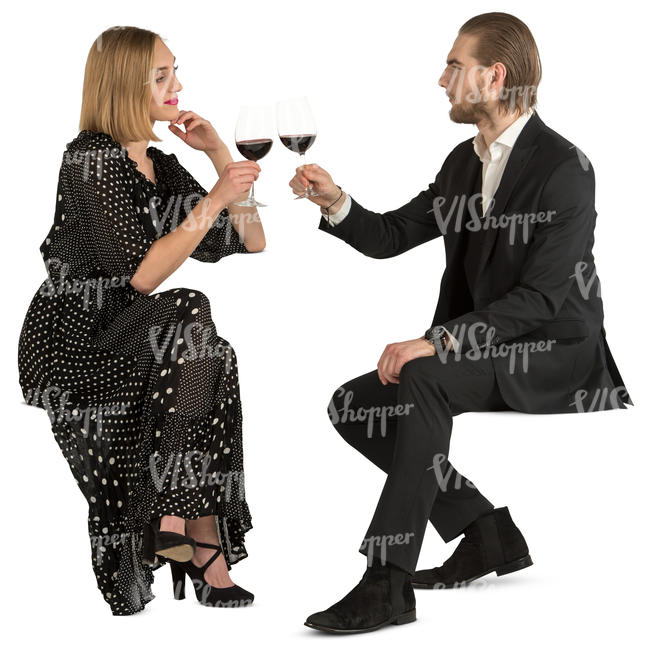 couple in fancy clothes sitting in a restaurant