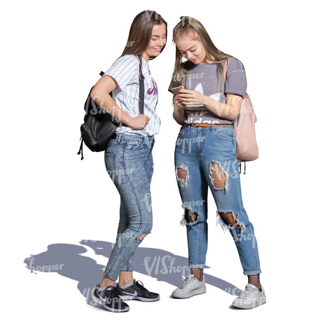 two teenage girls standing and looking at the phone