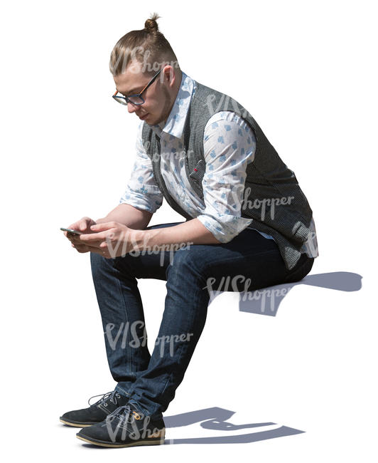 man sitting and texting