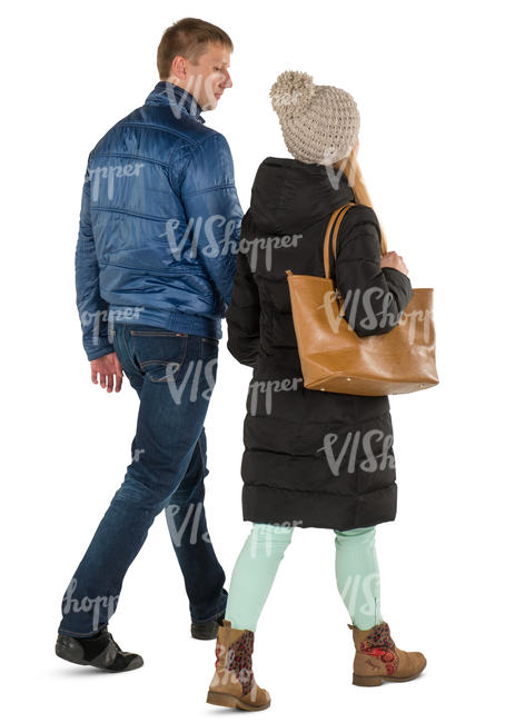 man and woman in winter coats walking