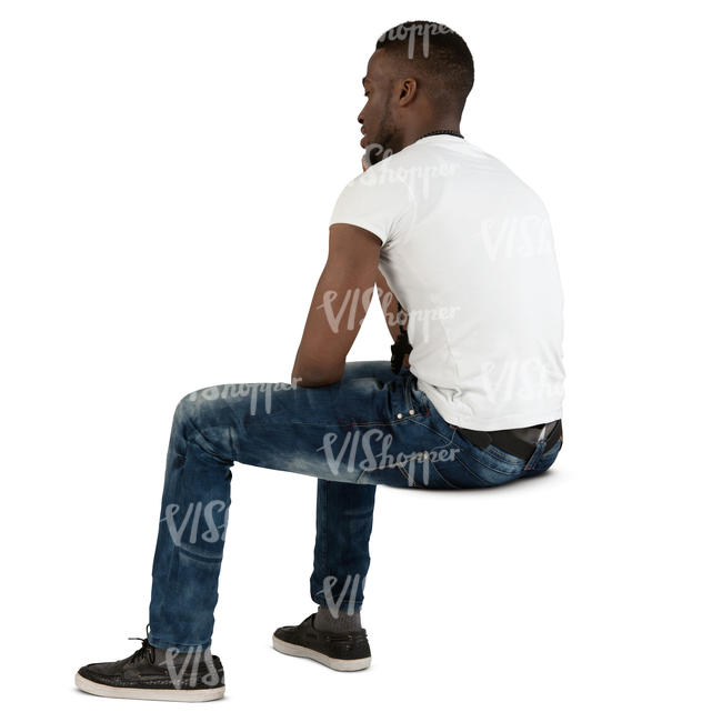 african man sitting and talking on a phone