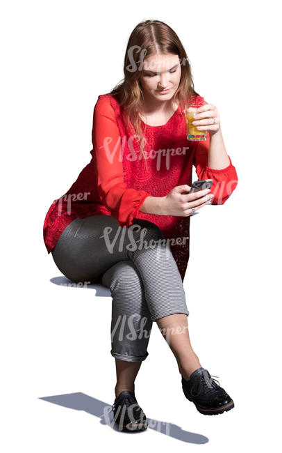 young woman sitting in a cafe and drinking juice