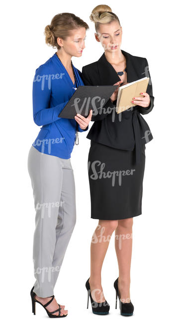 two female office workers looking at their notes