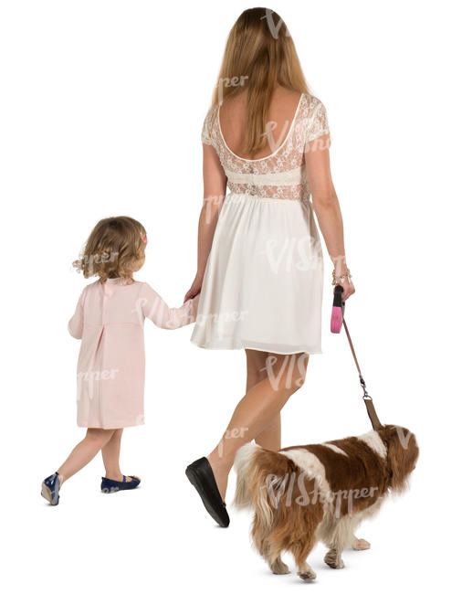 mother and daughter walking with a dog