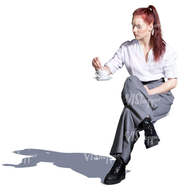 young woman sitting in a street cafe