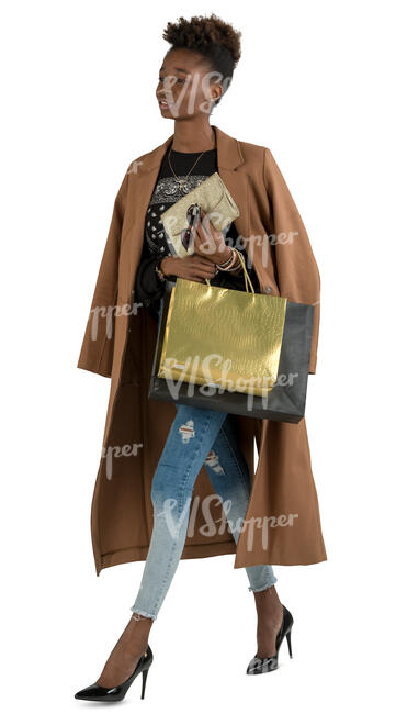 black woman with shopping bags walking