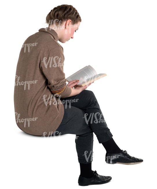 young woman sitting and reading a book