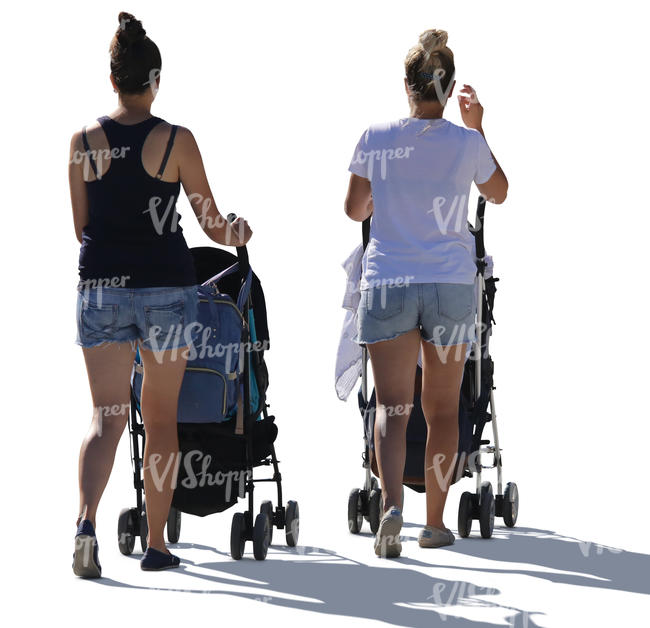 two backlit women with baby carriages walking