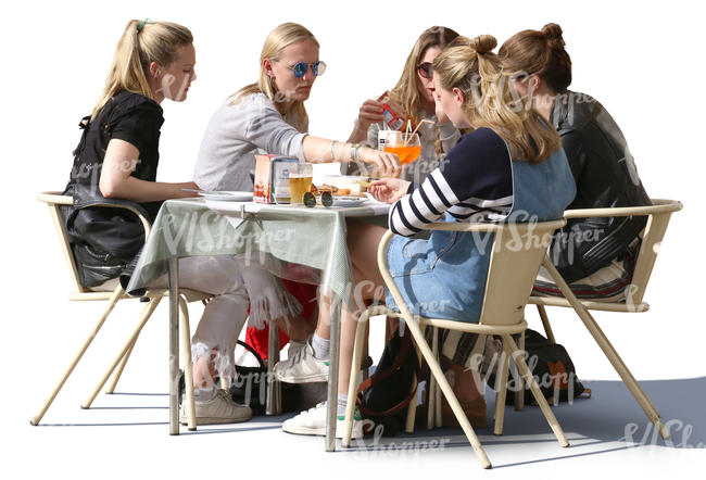 group of women sitting at a street cafe