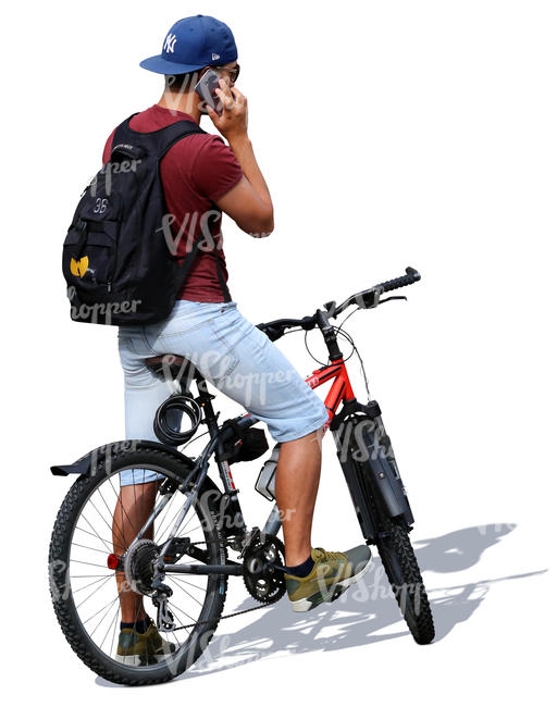 man with a bicycle standing and talking on the phone