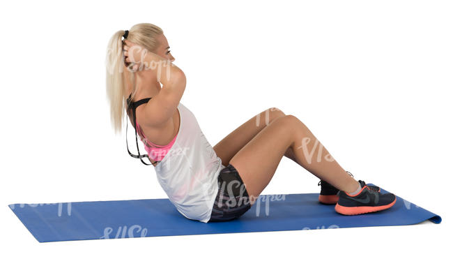 woman doing exercises on a yoga mat