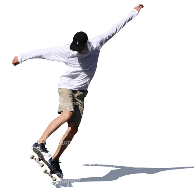 teenage boy doing a stunt on a skateboard