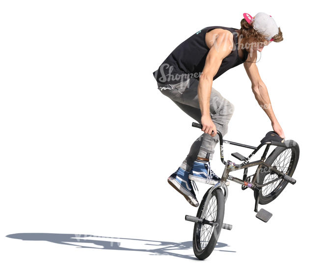 young man performing a stunt with his bmx