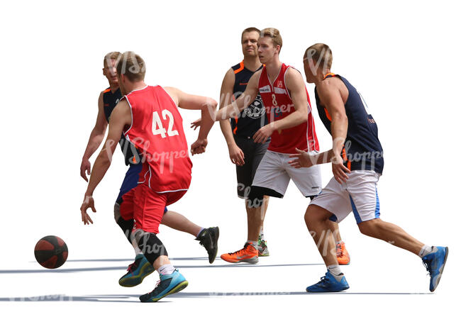 five men playing street basketball