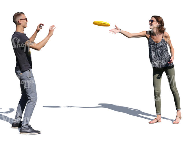 man and woman playing frisbee on a sunny day