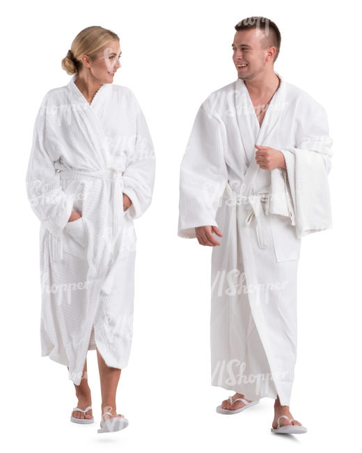 man and woman in white bathrobes walking